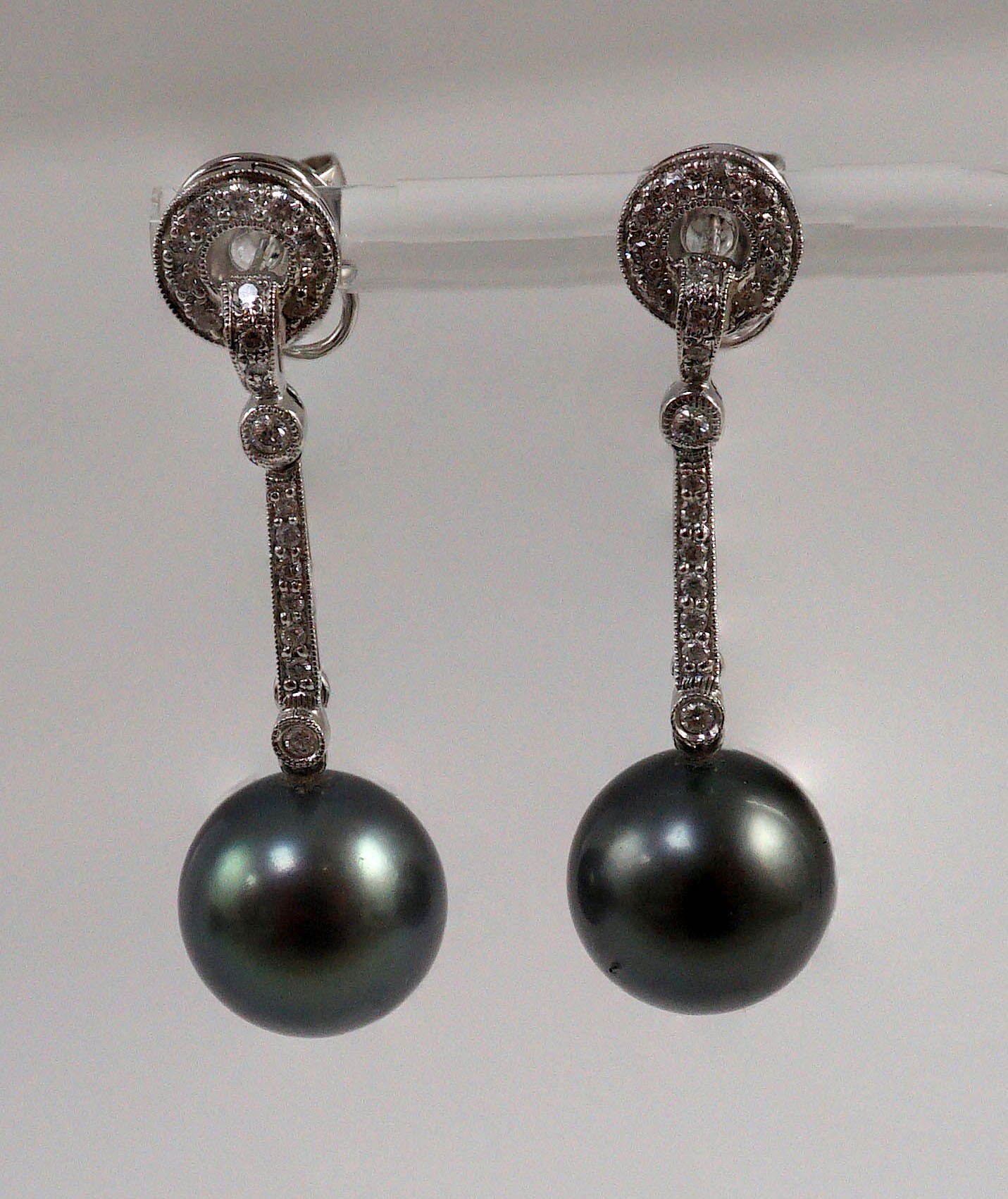 A modern pair of single stone South Sea Tahitian pearl style and diamond chip set drop earrings